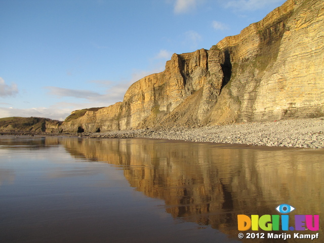 SX25591 Cliffs reflected in water on beach